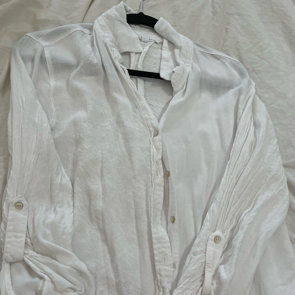 White button down shirt. Cotton blend. Very soft!